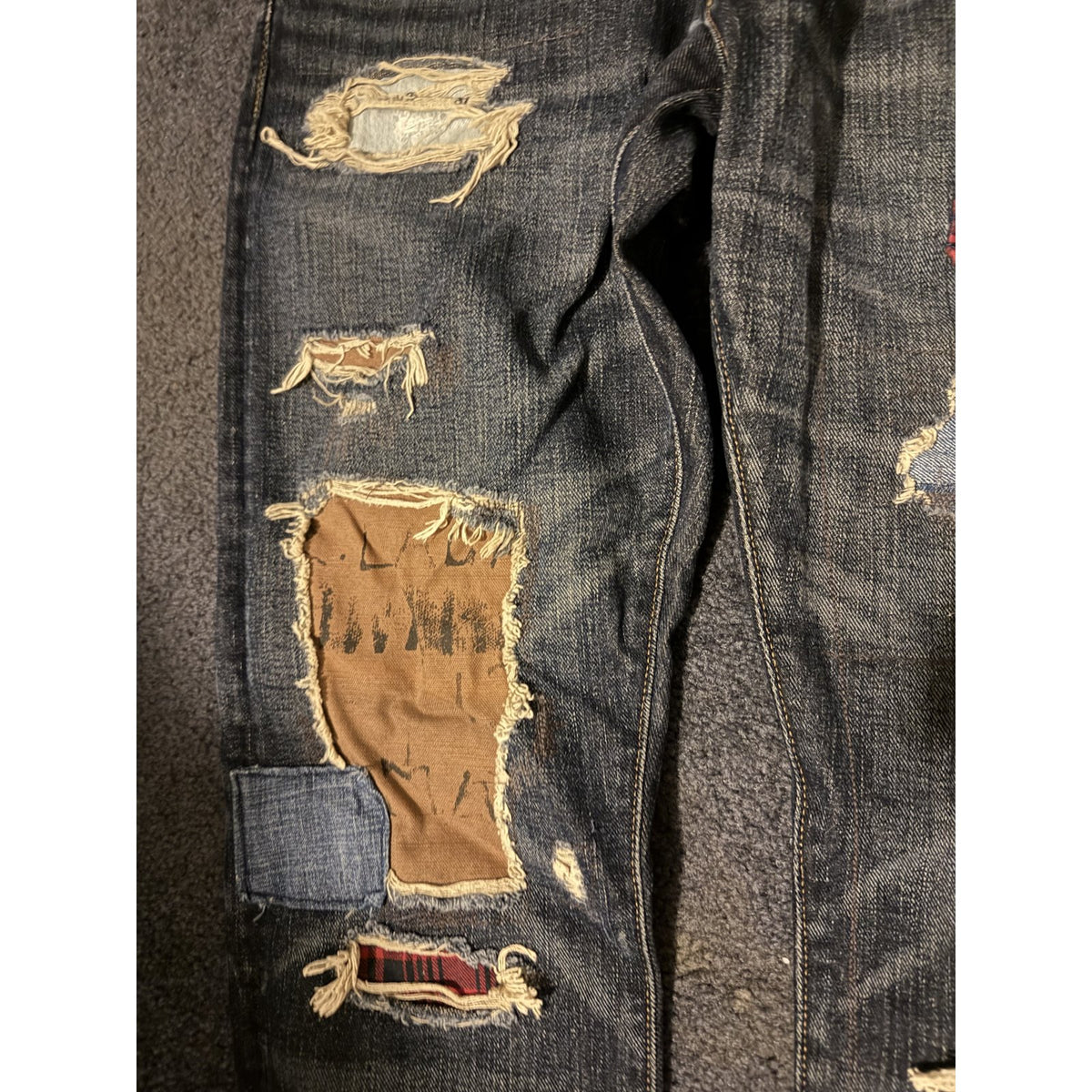 Polo Ralph Lauren patchwork repaired jeans — repair and distressing detail
